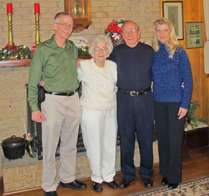My parents flanked by my sister, Martha, and me. 