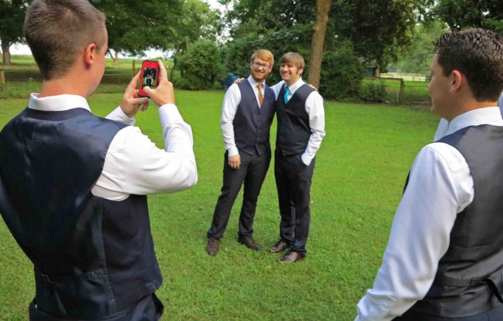 Garrett, Taylor's older brother, taking pictures of Taylor and his friends. 